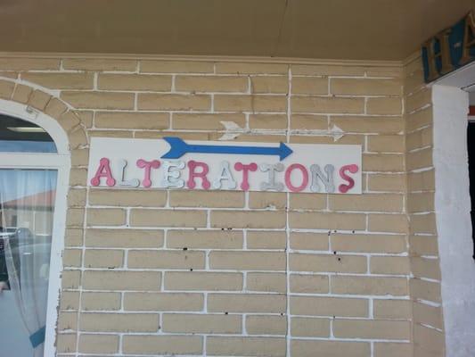 In McRae's Shopping Center, look for this arrow. The correct address is 9627 Sims, Suite G.