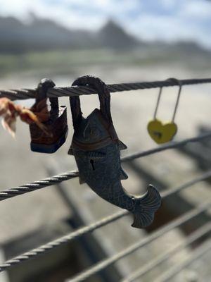 Locks attach to Pudding Creek bridge next to hotel