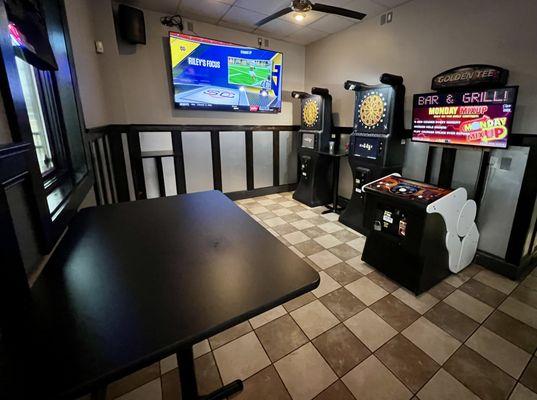 Game Room featuring Golden Tee and two Dart Machines