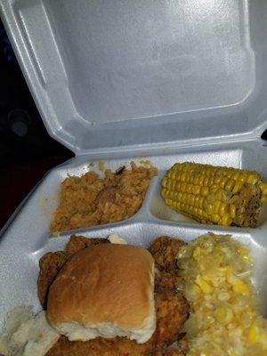 Jambalaya rice, corn on the cob, pork chop, rolls