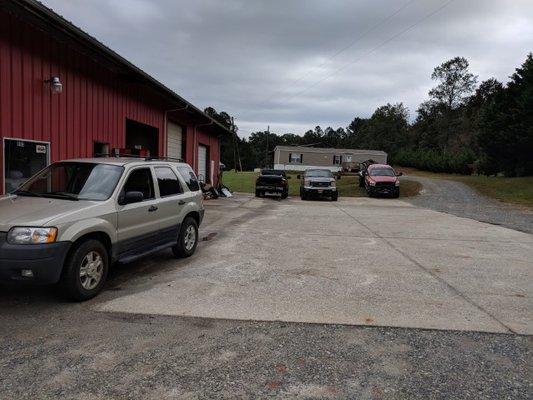 Pull into the side of the shop onto the concrete for service