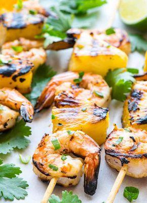 Grilled shrimps seasoned with indian spices .