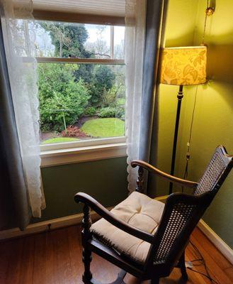 Bellas chair in front of the window.