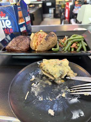 My half eaten stuffed mushroom and my steak dinner. I didn't take a photo of the salad.