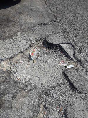 Pothole before covered up on 12-5-18 with injuries,  i reported the pothole on 12-7-18 to the city & the city came out with in 72 hour's rep