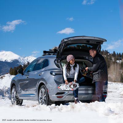 Even adults like to play in the snow. The Buick Envision with available Intelligent All-Wheel Drive.