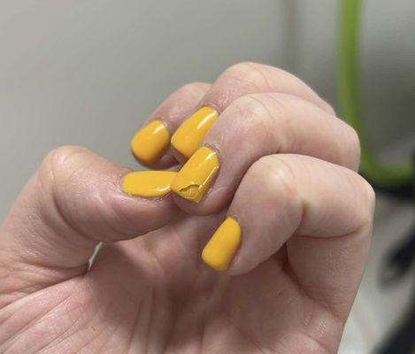 My nail that peeled back halfway the day after getting them done.