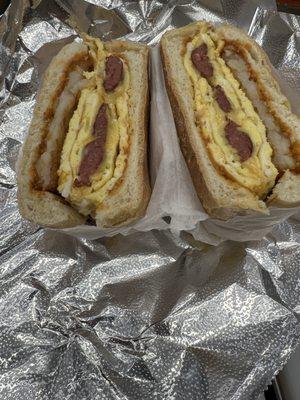 Beef Sausege, egg, cheese with hash brown on everything bagel with some chipotle mayo awesome