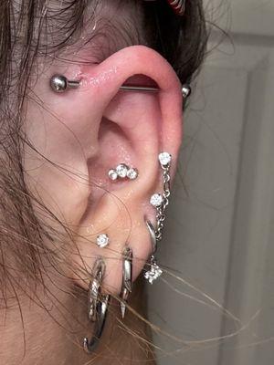 Industrial piercing causing great discomfort.