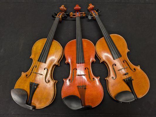 Three generations of violin making in one picture. Carl G, Carl F and Jennifer Becker pictured left to right.