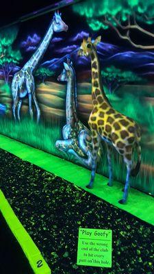 One of many scenes and themes from the glow in the dark/black light mini golf