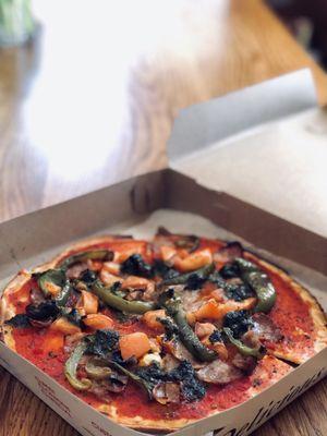 Sausage & Pepper topping with added tomatoes and pesto, amazing combination!