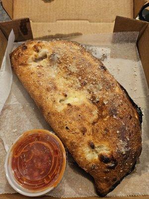 Calzone with ham, mozzarella & ricotta. Edges a lil dark