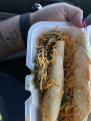 Rolled tacos with guacamole and cheese