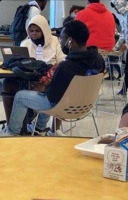 A student at Worthing eating his own lunch due to the low quality food that is sadly being served.