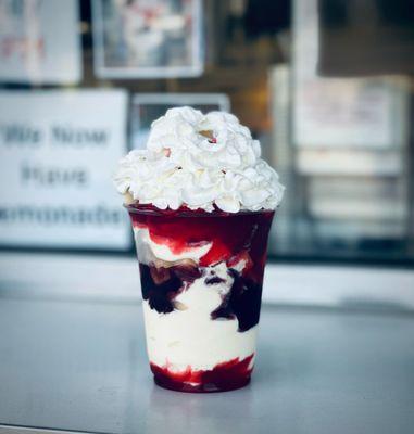 Patriot Parfait: ice cream layered with blueberry and strawberry topping and cheesecake