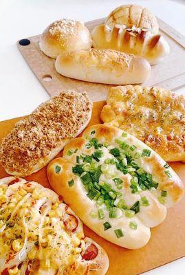 Scallion bun, corn & sausage bun, Russian bread (dense bread) etc.