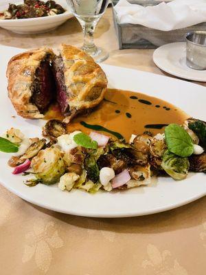Beef Wellington with fall vegetables.