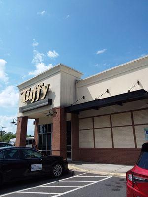 Entrance is part of a strip mall next to Firehouse Subs