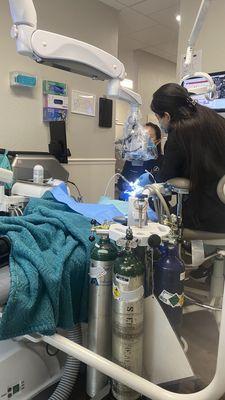 My daughter getting the root canal on first tooth.