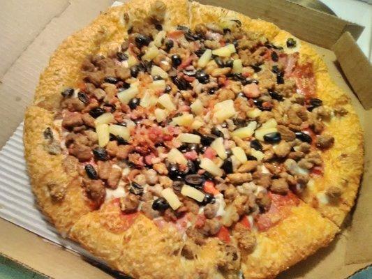 Unusually good pizza tonight at Pizza Hut in Russell, Kansas. Meat Lovers with pineapple and black olives. Crust is Parmesan hand-tossed.