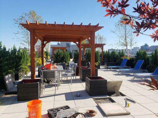 When looking for a way to stabilize pergola posts using large heavy planters filled planters will stabilize pergola posts add climbers too!