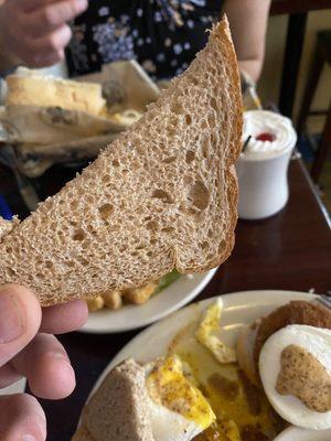 This is their version of toast, which came out cold and with no indication that this piece of bread had ever met a toaster.