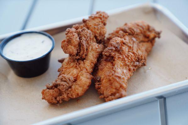 Chicken tenders available with side of sauce or upgrade to a sauce flight.