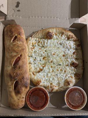 Pepperoni Stromboli and Happy Bread, each come with one dipping sauce of marinara.