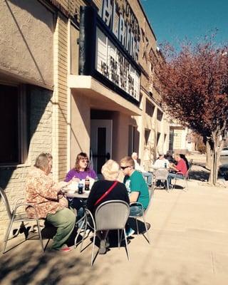 People enjoying the theater's good food, outside seating, and amazing weather!