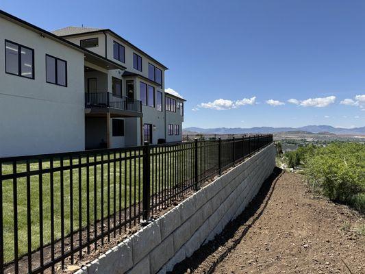 Back-yard retaining wall overviewing the valley and creating a flat level back-yard