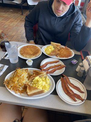 bacon, eggs, white toast, waffles, hashbrowns