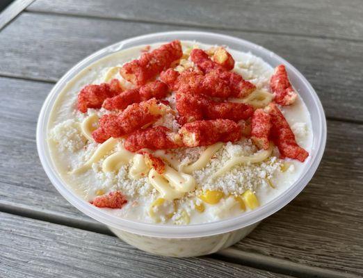 "Elotes" creamed corn with hot Cheetos