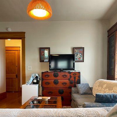 A view of their king room, facing away from Larchmere Blvd, with a little of the wall art