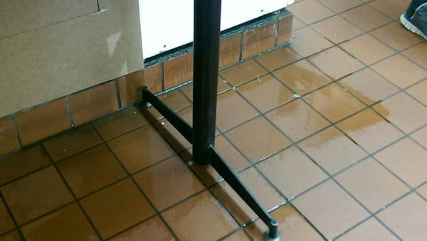 Water on the floor from leaky washers