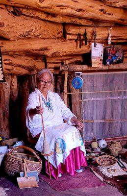 Loretta demonstrates spinning wool