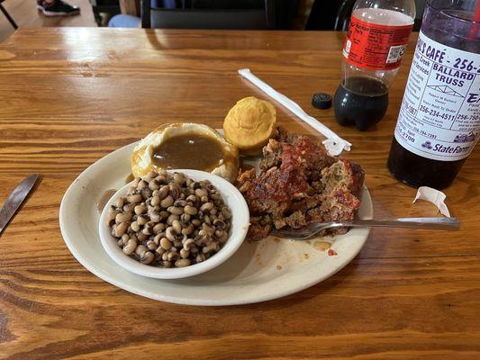 Black eyes, mashed potatoes, and meatloaf, with a muffin.