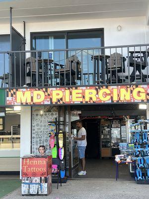MD Piercing located on ocean city boardwalk 10th street I believe. One of the employees.