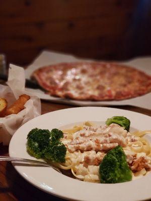 Chicken Alfredo, fried Mozzarella cheese sticks, and a large Cheese and Sausage Pizza.