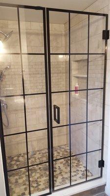 Frameless shower door with black mullions