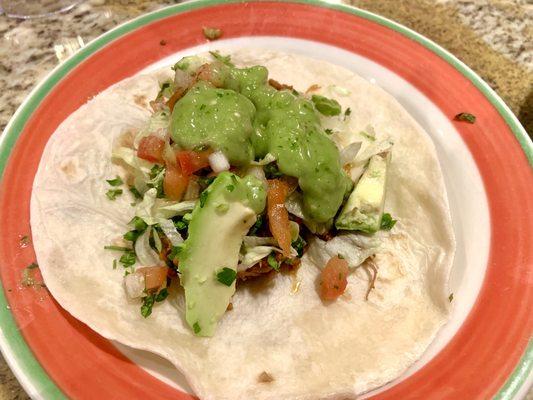 Flour tortilla filled with season shredded pork, sliced avocado, lettuce, cilantro, pico de gallo and topped with avocado sauce.