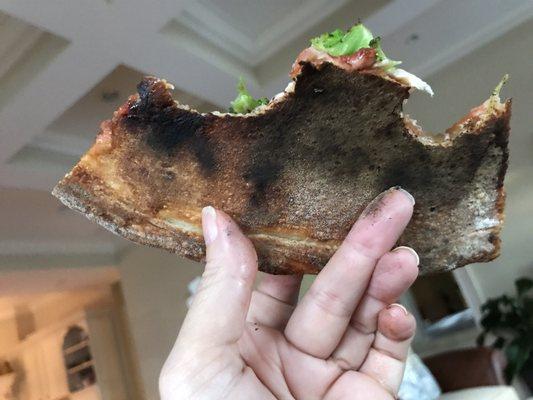 Burned. Ruined taste. Yes, I ate 2 slices because I was so hungry and the rest went into the trash. I've NEVER thrown pizza away before