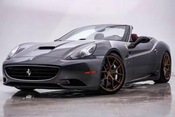 2011 Ferrari California Grigio Grey exterior, Red interior. $26k miles, sold on 1/25/25