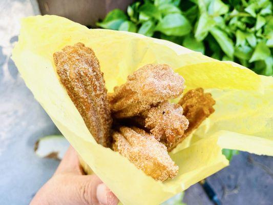 Fresh made churros from the stand at the same corner. Nice and hot. Made with a smile. Giggles shared with the people in line.