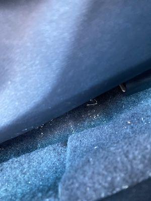 Bunch of dirt in between car seats, and inside the consul