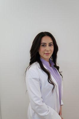 Photo of the TCM Practitioner, Dr. Talin Mirzakhanian, DAcCHM, in her white coat