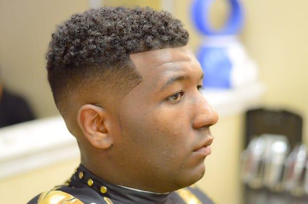 Faded sides with a curly top.