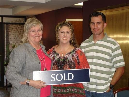 Donna Clayton Lloyd (Left) with the Allisons. SOLD one and BOUGHT one!   Thanks for the privilege of being your REALTOR.