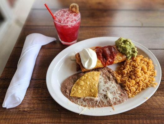 Drink from bar asada chimichanga plate with rice and beans.