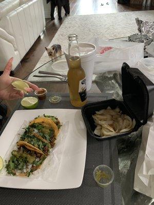 Carne asada taquitos and grilled onions